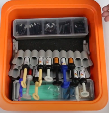 A picture containing container, plastic, orange, tool

Description automatically generated
